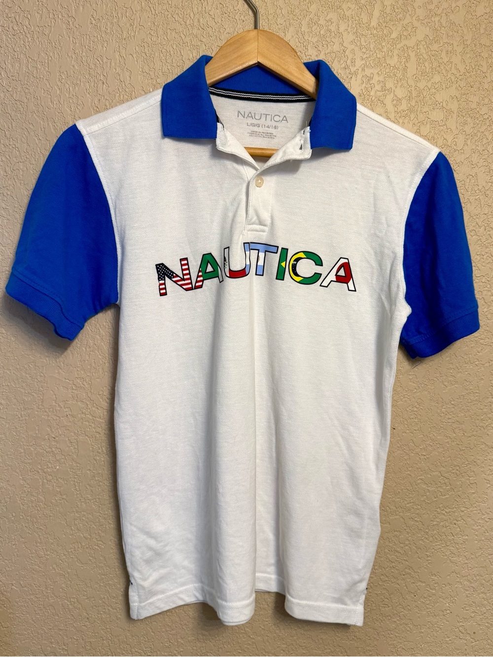 Nautica White Polo Shirt with Blue Collared Sleeves and Multicolor Logo